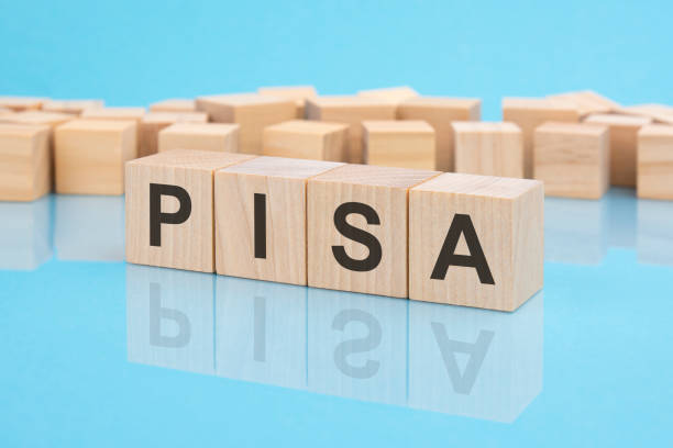 istock wooden blocks with the word Pisa, blue background 1392410893