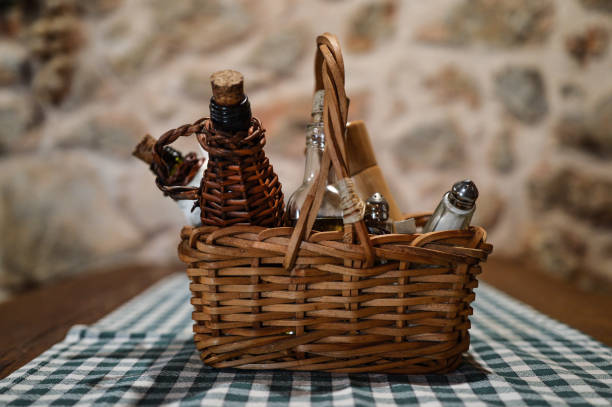 istock Basket with spices on a wooden table with white and green tablecloth 1392411027