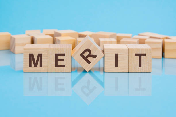 istock word merit made with wood building blocks, business concept 1392411043