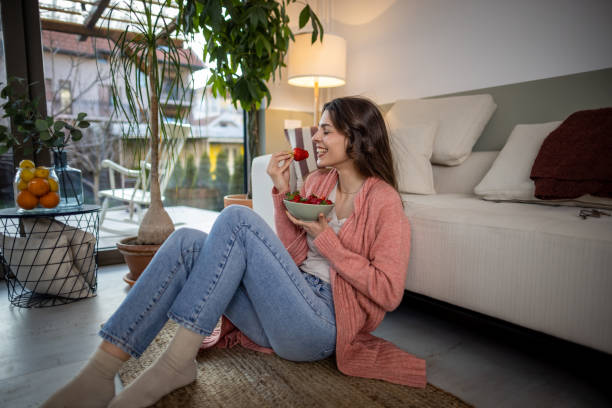 istock Woman eating fresh fruit snack 1392411047