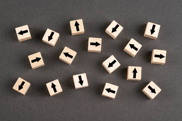 istock Wooden block cubes with arrows 1392411701