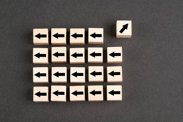 istock Wooden block cubes with arrows 1392411717