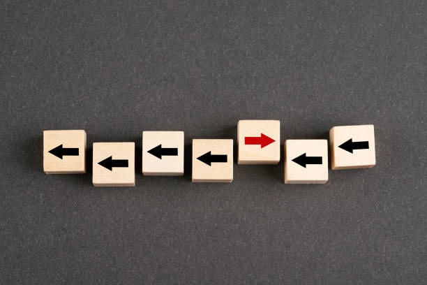 istock Wooden block cubes with arrows 1392411776