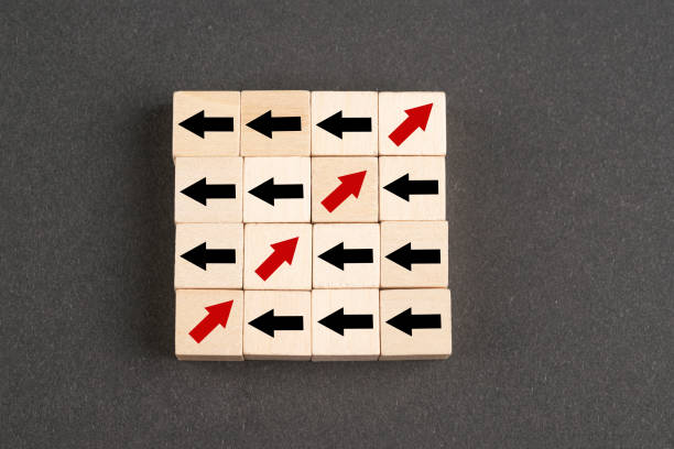 istock Wooden block cubes with arrows 1392411822