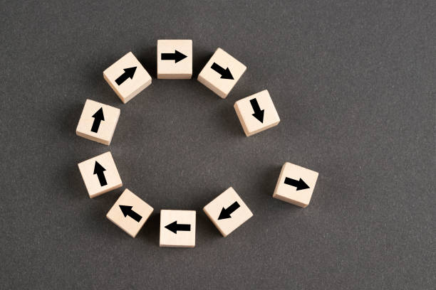 istock Wooden block cubes with arrows 1392411836