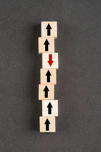 istock Wooden block cubes with arrows 1392411852