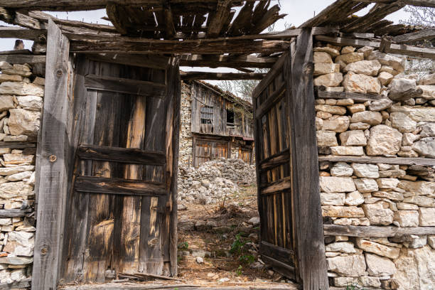 istock Wooden Door in Stone Wall 1392415011