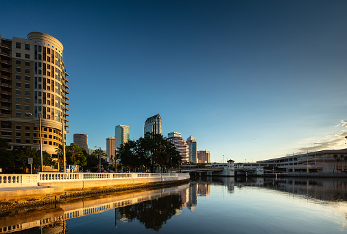 Sunrise in Tampa, Florida from the mouth of the Hillsborough River, looking upstream towards Platt Street Bridge and downtown skyscrapers. This image is part of a series of views taken at different times of day from the same location; a time lapse is also available.