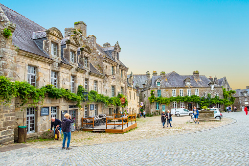 Locronan, France - September 17, 2019: Medieval streets of Locronan, a small town in Brittany, France. It is one of the most beautiful villages in France.