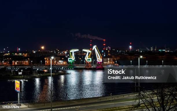 04092022 Illuminated Colourful Old Port Cranes On A Boulevard In Szczecin City At Night Poland Stock Photo - Download Image Now