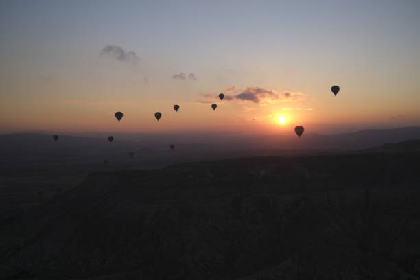 a few hot air balloons on sunrise stock photo