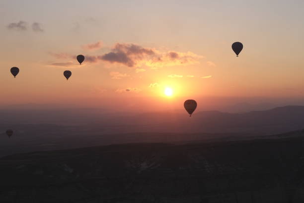 a few hot air balloons on sunrise stock photo