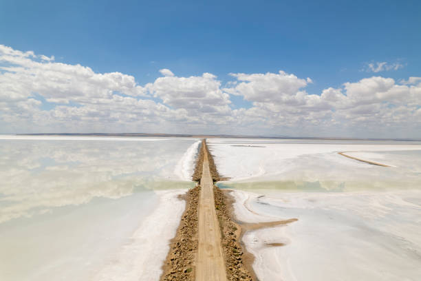 a road from a salt lake stock photo