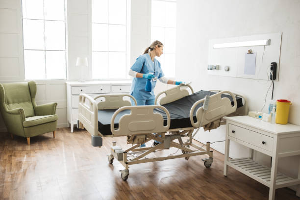 istock Nurse cleaning hospital ward. 1392421530