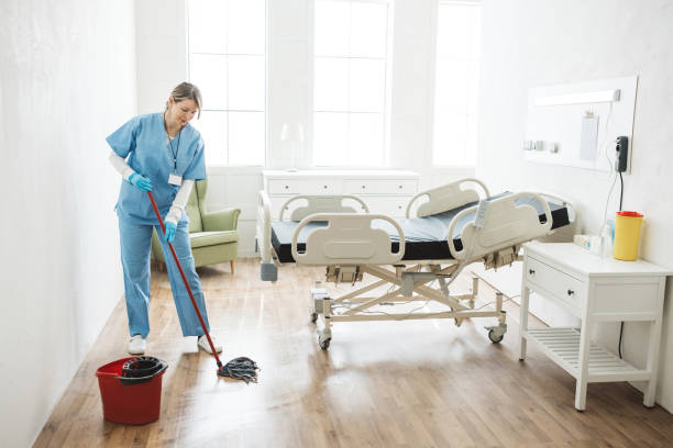 istock Nurse cleaning hospital ward. 1392421533