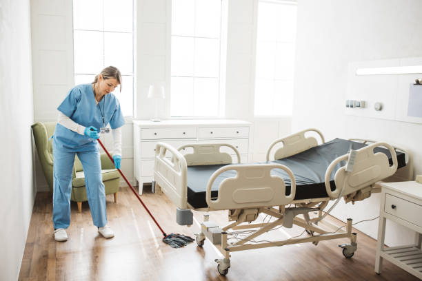 istock Nurse cleaning hospital ward. 1392421546
