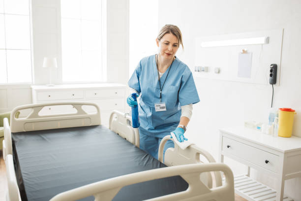 istock Nurse cleaning hospital ward. 1392421558