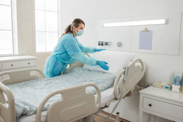 istock Nurse cleaning hospital ward. 1392421603