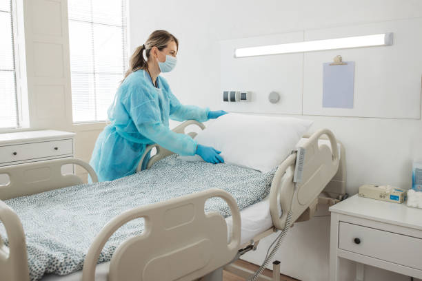 istock Nurse cleaning hospital ward. 1392421604