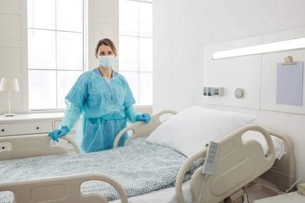 istock Nurse cleaning hospital ward. 1392421605