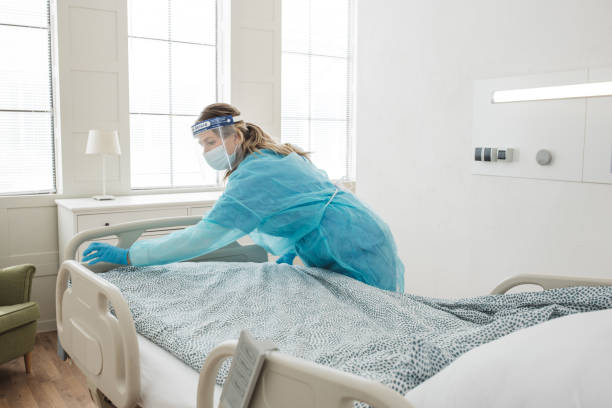 istock Nurse cleaning hospital ward. 1392421619