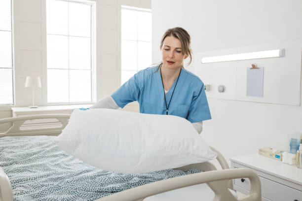 istock Nurse cleaning hospital ward. 1392421629