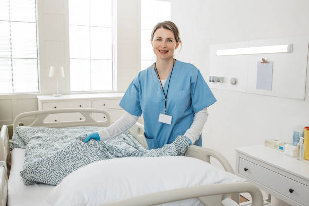 istock Nurse cleaning hospital ward. 1392421636