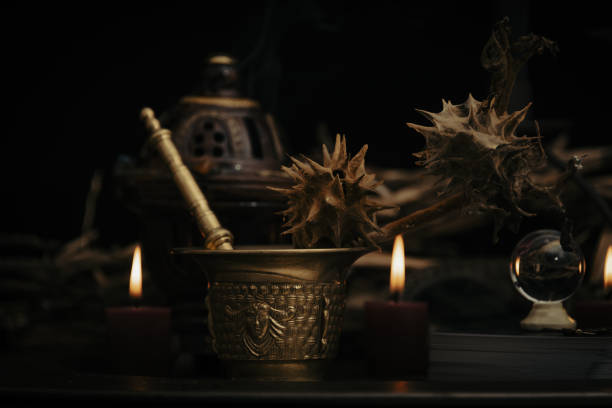 istock Talking spiritual board with black candles and old key. Wicca, esoteric and occult background with vintage magic objects for mystic rituals. Halloween and gothic concept. 1392425142