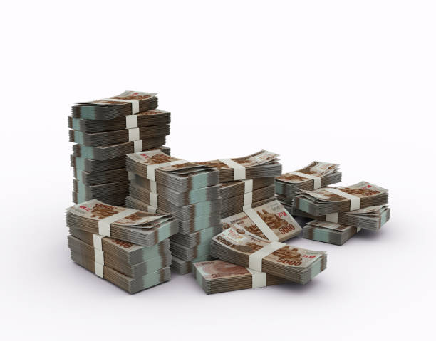istock Stack of North Korean won notes. 3d rendering of bundles of money isolated on white background 1392425320