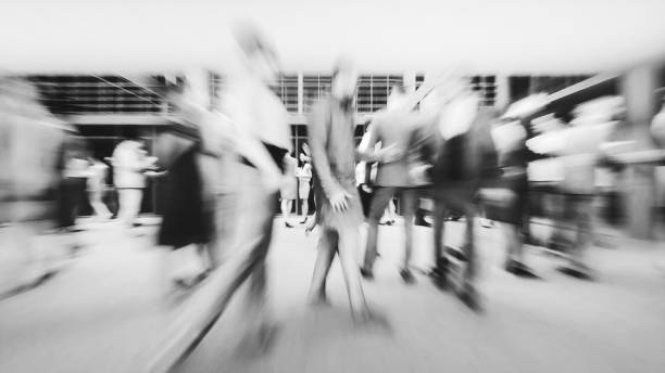 istock Office building lobby with business people in motion 1392425326