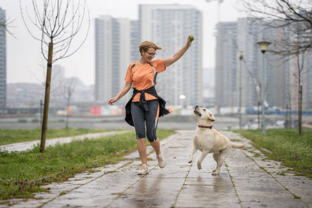 Woman playing with dog