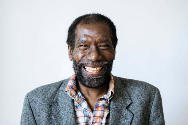 istock Cheerful senior man portrait on plain background 1392429212
