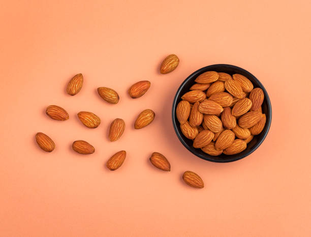 istock Organic peeled almonds in the bowl - Prunus dulcis 1392440418