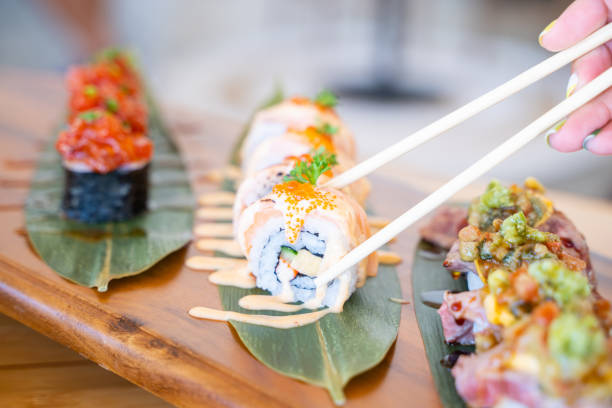 istock sushi and salmon roll serve on wooden tray 1392440701