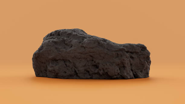 istock Isolated dark rocks in a yellow background  monochrome rock model 1392445459