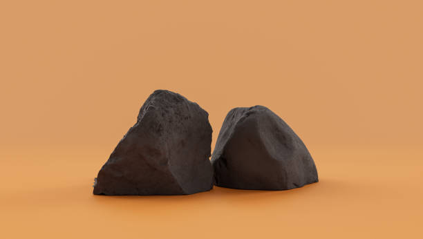istock Isolated dark rocks in a yellow background  monochrome rock model 1392445529