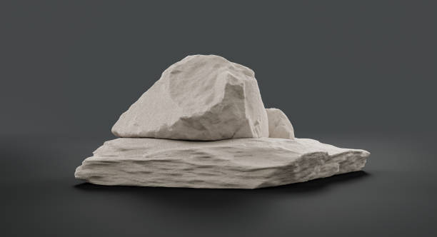 istock Single color white rocks in a flat grey color background  monochrome rock model 1392446562