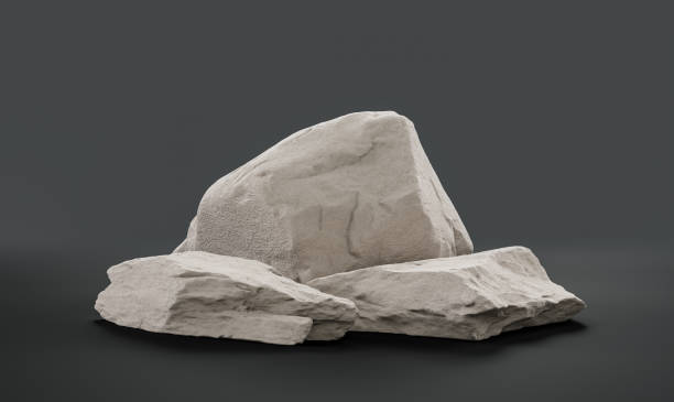 istock Single color white rocks in a flat grey color background  monochrome rock model 1392446586
