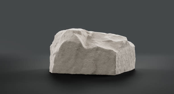 istock Single color white rocks in a flat grey color background  monochrome rock model 1392446606