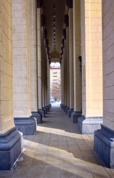 A high colonnade with a stone floor