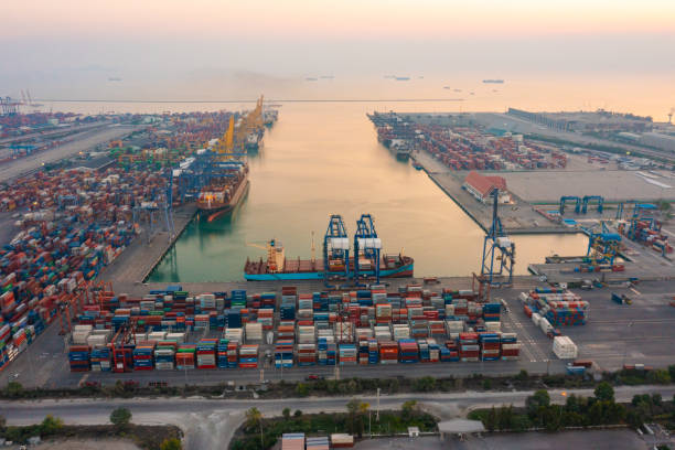 aerial top view of container cargo ship in the export and import business and logistics international goods in urban city. shipping to the harbor by crane in laem chabang, chon buri, thailand - harbor cargo container commercial dock container imagens e fotografias de stock