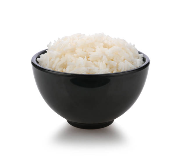 rice in black bowl on white background