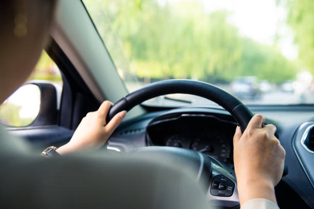 istock women hand driving car 1392453536