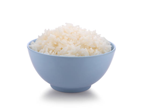 istock Rice in blue bowl on white background 1392453601