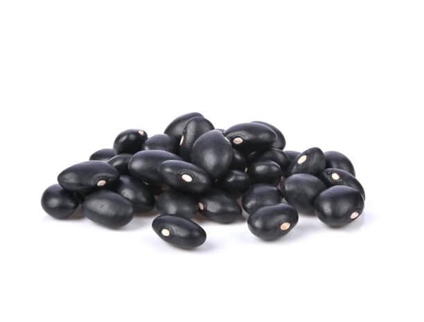 istock Heap of Black beans isolated on white background. 1392453639