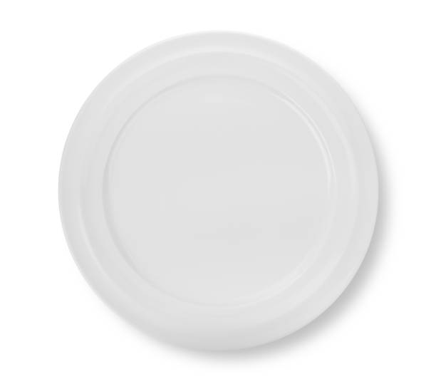 istock White plate isolated on white background. Top view 1392454492