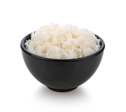 Boiled Rice in black bowl isolated on white background