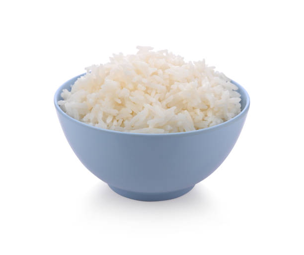 istock Rice in blue bowl isolated on white background 1392454865