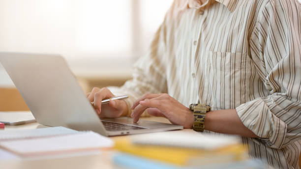 istock Cropped image, Businessman or male worker using laptop computer 1392459557