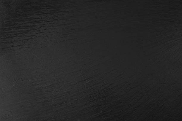 istock Dark black slate background or texture, Black slate tile top view 1392460991